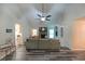 Bright living room featuring vaulted ceilings, stone fireplace, built-ins, and modern flooring at 180 Kim Trail Trl, Stockbridge, GA 30281