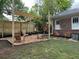 Backyard with a shade sail, lounge chairs, wooden fence and landscaping at 1134 Donnelly Sw Ave, Atlanta, GA 30310