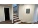 Basement featuring stairs and a door at 1134 Donnelly Sw Ave, Atlanta, GA 30310