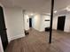 Finished basement with tiled floors, white walls, and dark doors at 1134 Donnelly Sw Ave, Atlanta, GA 30310