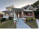 Beautiful brick home showcasing a cozy covered porch and well-manicured lawn at 1134 Donnelly Sw Ave, Atlanta, GA 30310