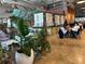 The interior features tropical decor, cozy seating, and lush plants at 1134 Donnelly Sw Ave, Atlanta, GA 30310
