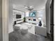 Staged living room boasting an exposed brick wall and wood tile floors for rustic charm at 1134 Donnelly Sw Ave, Atlanta, GA 30310