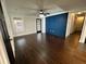 Spacious living room with hardwood floors, accent wall, and modern ceiling fan at 1134 Donnelly Sw Ave, Atlanta, GA 30310