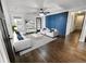 Staged living room featuring hardwood floors, stylish decor, and an accent wall at 1134 Donnelly Sw Ave, Atlanta, GA 30310