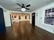 Open-concept living area featuring hardwood floors, modern lighting, and a view to the kitchen at 1134 Donnelly Sw Ave, Atlanta, GA 30310