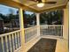 Covered porch with a ceiling fan and decorative railings overlooking the neighborhood at 1134 Donnelly Sw Ave, Atlanta, GA 30310