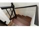 View of staircase featuring dark brown stairs and black railing at 1134 Donnelly Sw Ave, Atlanta, GA 30310