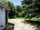 Backyard patio with lush greenery and ample space at 148 Barrington Pkwy, Stockbridge, GA 30281