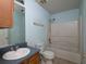 Bathroom with a vanity, toilet, and a shower-tub combo at 148 Barrington Pkwy, Stockbridge, GA 30281