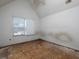 Bedroom with a vaulted ceiling and a large window providing natural light at 148 Barrington Pkwy, Stockbridge, GA 30281