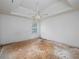 Bedroom featuring tray ceiling and window providing natural light at 148 Barrington Pkwy, Stockbridge, GA 30281