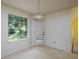Bright breakfast nook with large windows and a door to the backyard, offering peaceful views at 148 Barrington Pkwy, Stockbridge, GA 30281