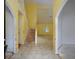 Open entryway with tile flooring, a staircase, and arched doorways offering a view into other rooms at 148 Barrington Pkwy, Stockbridge, GA 30281