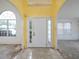 A bright foyer boasts tile flooring, arched doorways, and natural light streaming through large windows at 148 Barrington Pkwy, Stockbridge, GA 30281