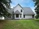 Back exterior view of home showcasing manicured lawn at 148 Barrington Pkwy, Stockbridge, GA 30281