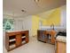 Kitchen with stainless steel appliances, island, and a sink overlooking the backyard at 148 Barrington Pkwy, Stockbridge, GA 30281