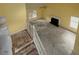 Spacious living room with fireplace, high ceilings, and large windows for natural light at 148 Barrington Pkwy, Stockbridge, GA 30281