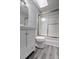 This bathroom features a shower with frosted glass doors and a modern vanity at 2773 Hawk Trace Ne Ct, Marietta, GA 30066