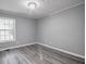 A simple bedroom with a window and hard flooring, ready for personalization at 2773 Hawk Trace Ne Ct, Marietta, GA 30066