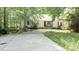 Charming single-Gathering home with mature trees and a spacious front yard and concrete driveway at 2773 Hawk Trace Ne Ct, Marietta, GA 30066