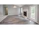 Bright living room boasts a fireplace and wood-look floors at 2773 Hawk Trace Ne Ct, Marietta, GA 30066