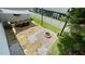 Aerial view of backyard patio featuring landscaping, a fire pit, outdoor furniture, and string lights at 420 Ashbury Cir, Dallas, GA 30157