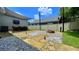 Backyard patio featuring landscaping, a fire pit, outdoor furniture, and string lights at 420 Ashbury Cir, Dallas, GA 30157