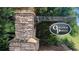 Stone entrance to Oakleigh Pointe community framed by lush landscaping, making a great first impression at 420 Ashbury Cir, Dallas, GA 30157