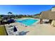 Large community pool with slide, umbrellas, and many chairs for residents to enjoy in a comfortable setting at 420 Ashbury Cir, Dallas, GA 30157