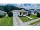 Well-manicured front yard with colorful flowerbeds and a charming front porch, enhancing the curb appeal of the property at 420 Ashbury Cir, Dallas, GA 30157