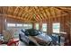 Spacious garage with a parked SUV and exposed wood beams showing the expansive vehicle and storage space at 420 Ashbury Cir, Dallas, GA 30157