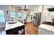 Bright kitchen with stainless steel appliances, white cabinets, and a center island at 420 Ashbury Cir, Dallas, GA 30157