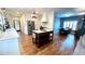 Open kitchen features a large center island, stainless steel appliances, and white cabinetry at 420 Ashbury Cir, Dallas, GA 30157