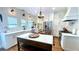 Bright kitchen with white cabinets, marble countertops, a center island, and stainless steel appliances at 420 Ashbury Cir, Dallas, GA 30157