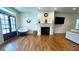 Cozy living room featuring shiplap accent wall, fireplace, and French doors to backyard at 420 Ashbury Cir, Dallas, GA 30157