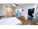 Bright main bedroom featuring stylish decor, hardwood floors, and an adjacent bathroom for easy access at 420 Ashbury Cir, Dallas, GA 30157
