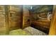 Outdoor shower with wood construction, faucet, and stone ground with vegetation at 420 Ashbury Cir, Dallas, GA 30157