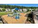 Well-equipped community playground with ample seating and a secure wood-chip ground cover at 420 Ashbury Cir, Dallas, GA 30157