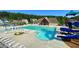 Community pool with lounge chairs, a covered pavilion, and a fun water slide for residents to enjoy at 420 Ashbury Cir, Dallas, GA 30157