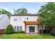 Back exterior view of home with well-maintained lawn and patio at 5035 Foxberry Ln, Roswell, GA 30075