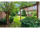 Landscaped backyard featuring an outdoor pergola at 5035 Foxberry Ln, Roswell, GA 30075