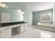 Bathroom with garden tub, double vanity and lots of natural light at 5035 Foxberry Ln, Roswell, GA 30075