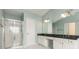 Bright bathroom with glass enclosed shower and dual sink vanity at 5035 Foxberry Ln, Roswell, GA 30075