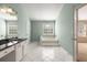 Bathroom with tile flooring, garden tub, and a large window at 5035 Foxberry Ln, Roswell, GA 30075