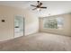 Bedroom features vaulted ceiling, ceiling fan, and ensuite bathroom at 5035 Foxberry Ln, Roswell, GA 30075
