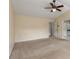 Spacious bedroom featuring a ceiling fan and neutral carpet at 5035 Foxberry Ln, Roswell, GA 30075