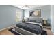 Bedroom with a large window, ceiling fan, and a neutral color palette at 5035 Foxberry Ln, Roswell, GA 30075