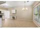 Kitchen dining area with chandelier and bright natural light at 5035 Foxberry Ln, Roswell, GA 30075
