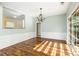 Dining area with chandelier, wainscoting, and sliding glass doors at 5035 Foxberry Ln, Roswell, GA 30075